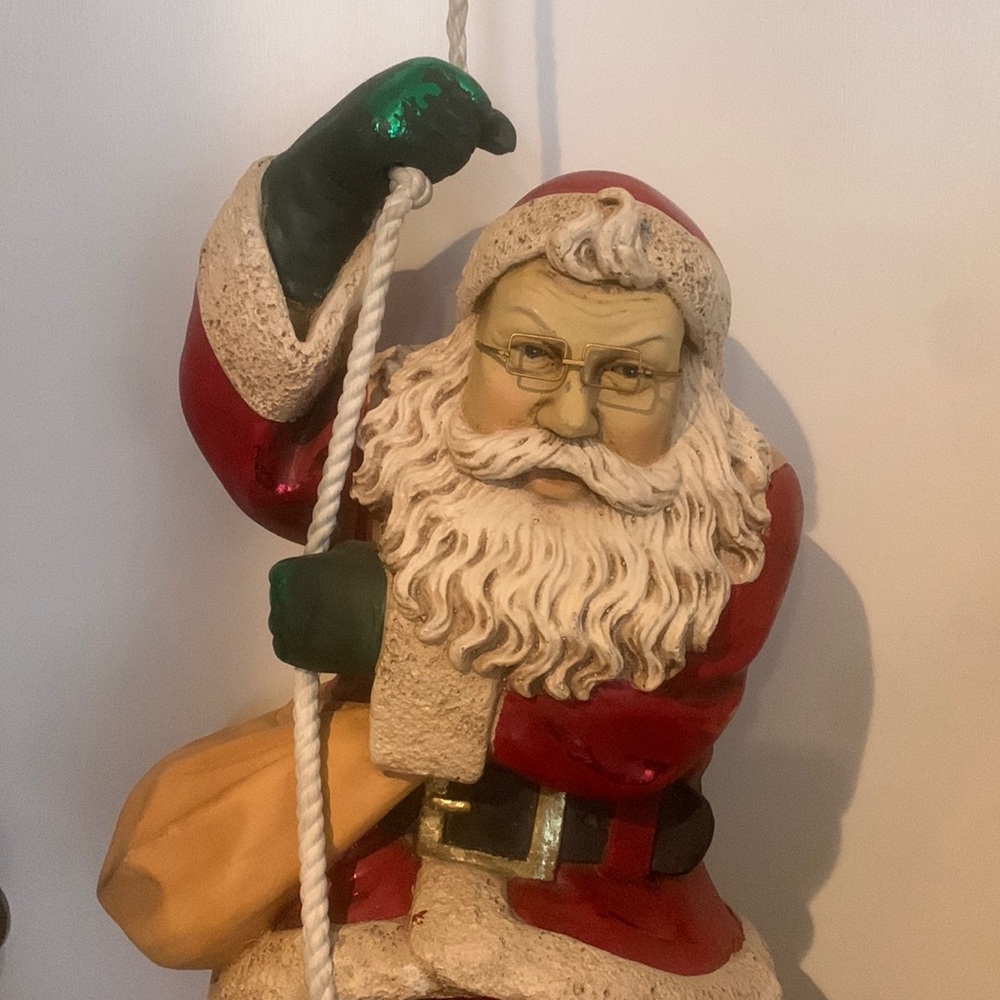 Santa sliding down rope.
